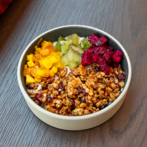 image shows a bowl containing oat cereal and fruit